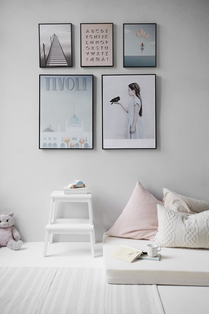 services-01 Minimalist Scandinavian bedroom with wall art and cozy decor elements.